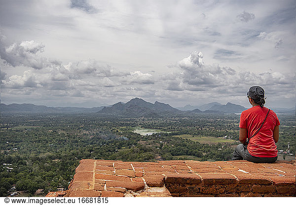 woman enyoing the view from the top of the Sigiriya rock fortress