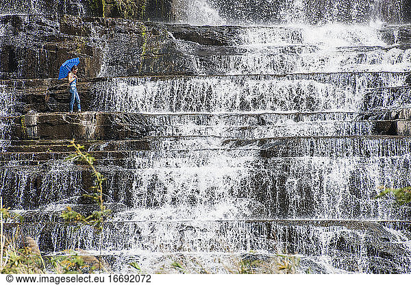 woman exploring the Pongour waterfall close to Da Lat in Vietnam