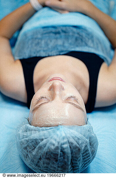 Woman facial treatment from beautician. Peeling  mask  skin care.