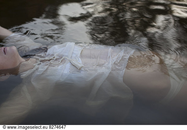 Woman floating in lake