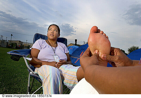 Woman gets a foot massage after a breast cancer walk in Washington  DC.