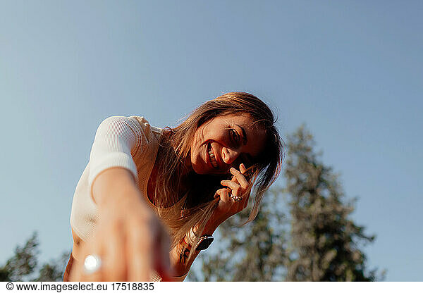 Woman gets pleasure from herself and from summer. Natural beauty