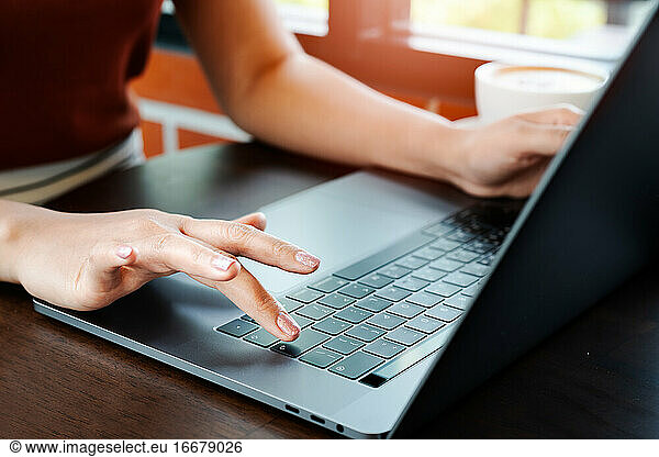 Woman hands office worker typing on the Enter keyboard