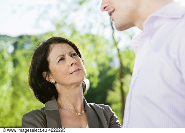Woman having a conversation with a man