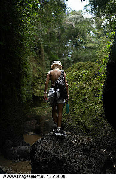 Woman hiking in the jungle.