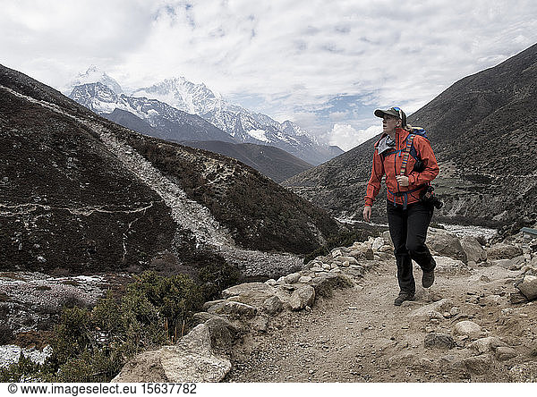 Woman hiking the Everest Base Camp trek near Dingboche  Himalayas  Solo Khumbu  Nepal