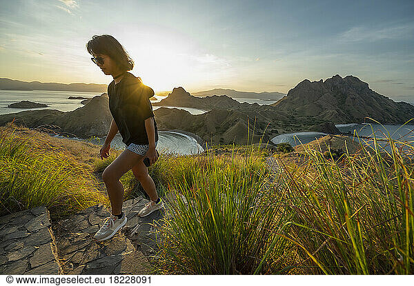 woman hiking up east Nusa Tenggara island in Komodo