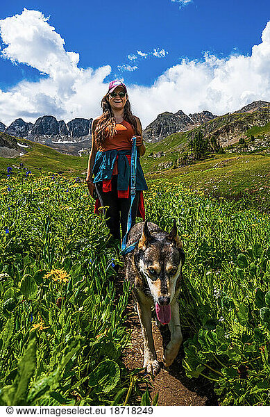 Woman hiking with Dog in the San Juan Mountains