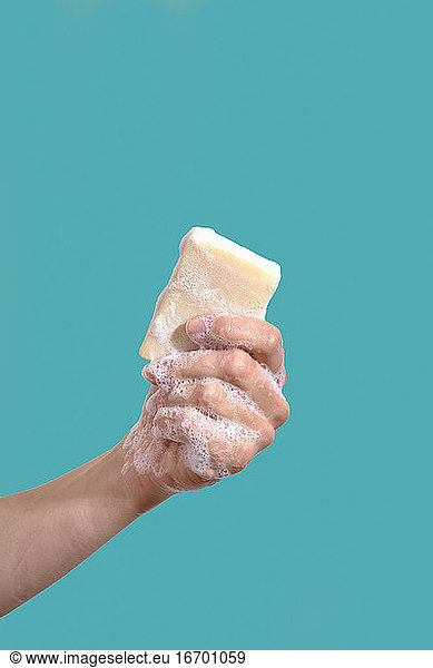 Woman hold piece of soap. Hygiene concept