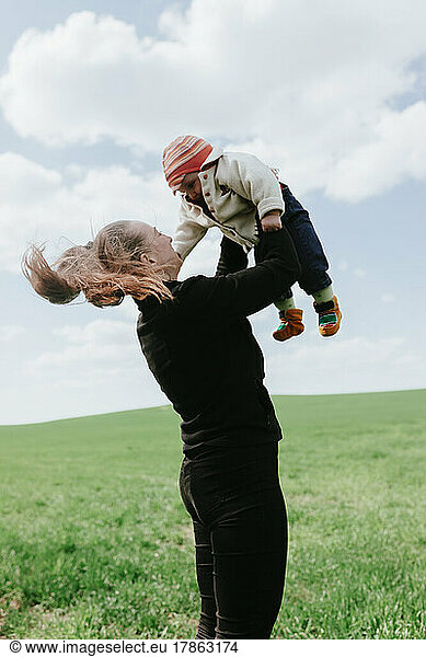 woman holding baby in her arms