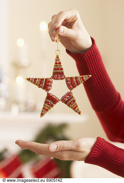 Woman Holding Christmas Ornament