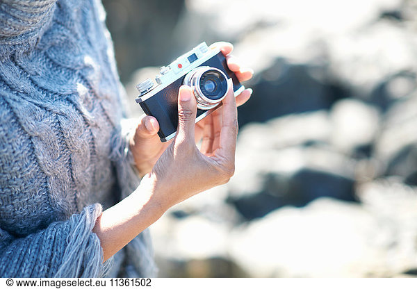 Woman holding film camera