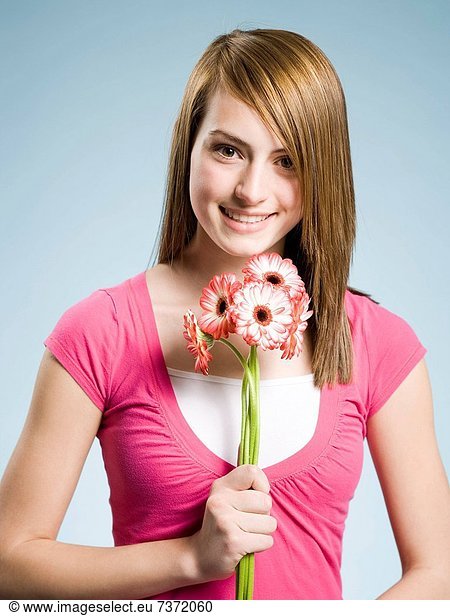 Woman holding flowers smiling