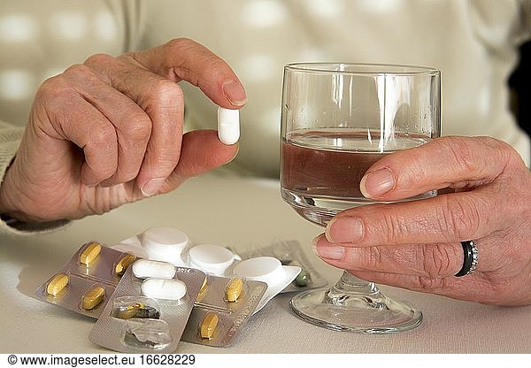 Woman holding medication pill  France  Europe