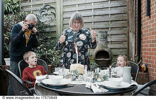 woman in her 70's celebrating her birthday with her family