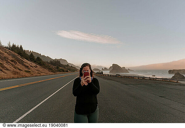 Woman in the middle of a coastal Oregon road