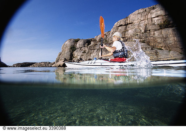 Woman kayaking  Sweden.