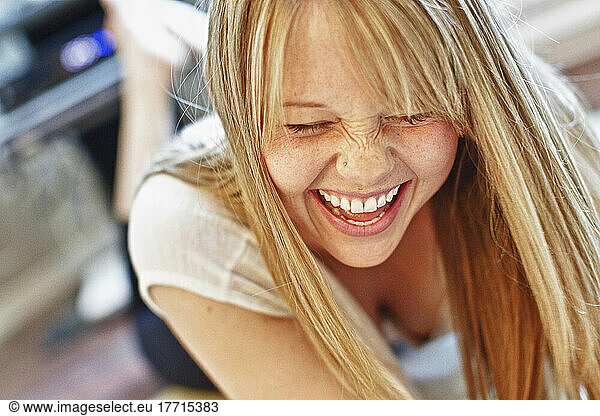 Woman Laying On Ground Laughing