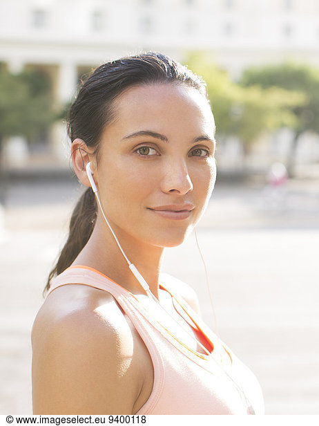 Woman listening to music before exercising