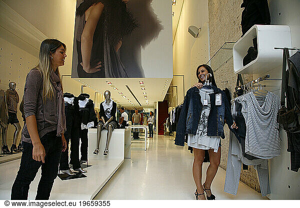 Woman looking at clothes in a fashion boutique on Rua Oscar Freire street  Jardins area  Sao Paulo  Brazil.