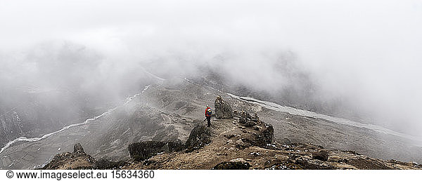 Woman looking at Dingboche  Himalayas  Solo Khumbu  Nepal