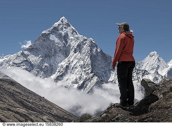Woman looking ath Nuptse mountain  Himalayas  Solo Khumbu  Nepal