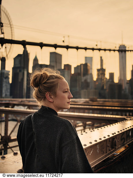 Woman looking away  cityscape in background