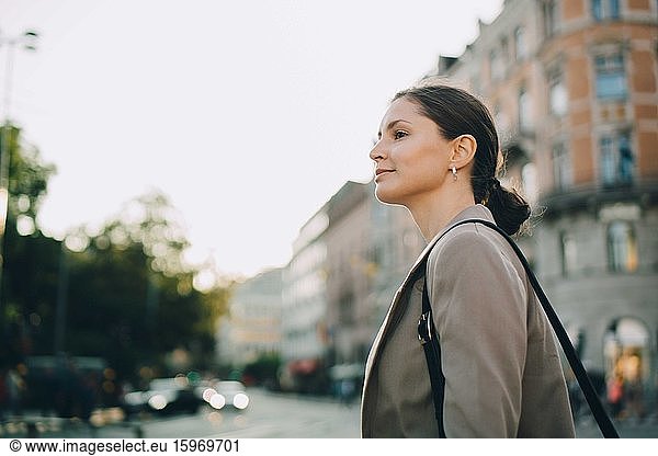 Woman looking away during city exploration