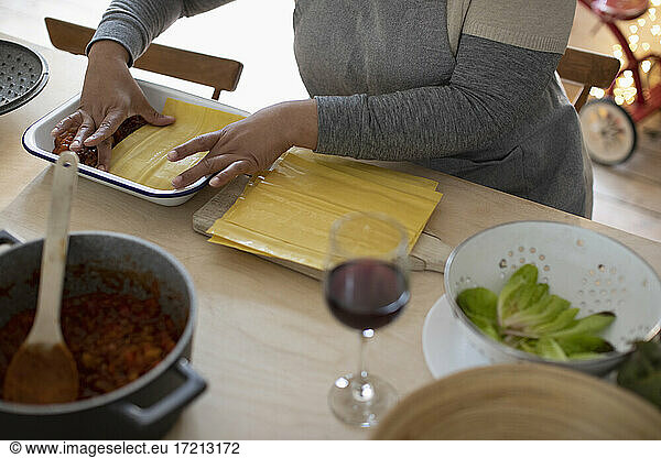 Woman making homemade lasagna