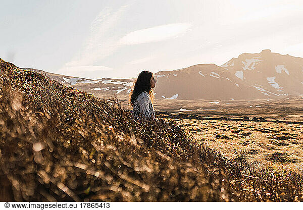 woman meditating in the landscapes of iceland