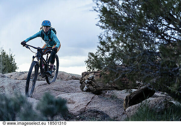 Woman mountain biking in the high desert in Colorado
