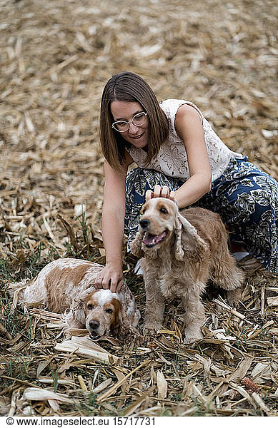 Woman on a field with her dogs