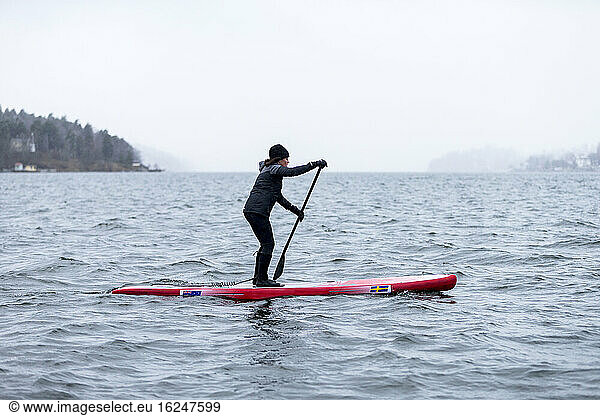 Woman paddle boarding