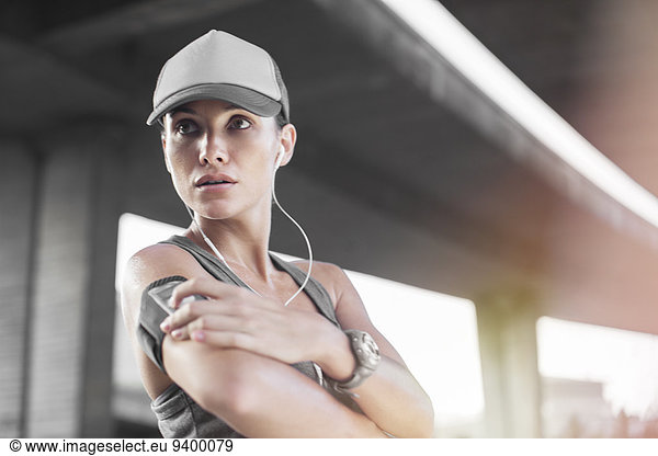 Woman playing music before exercising