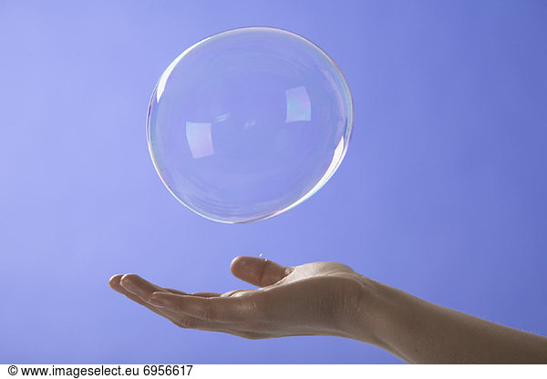 Woman Reaching for Bubble
