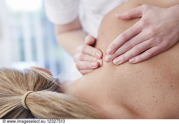 Woman receiving shoulder massage