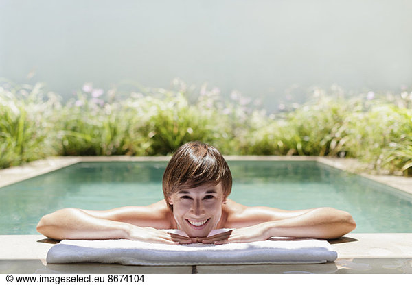 Woman relaxing in luxury lap pool