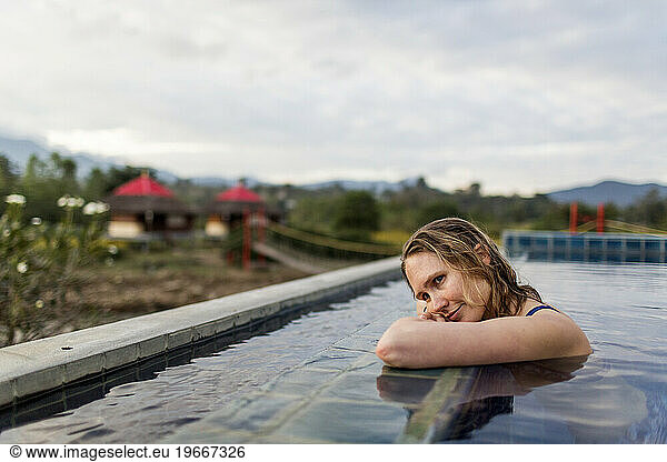 Woman relaxing in swimming pool  Pai  Mae Hong Soon  Thailand
