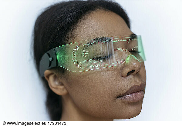 Woman relaxing with closed eyes wearing cyber glasses