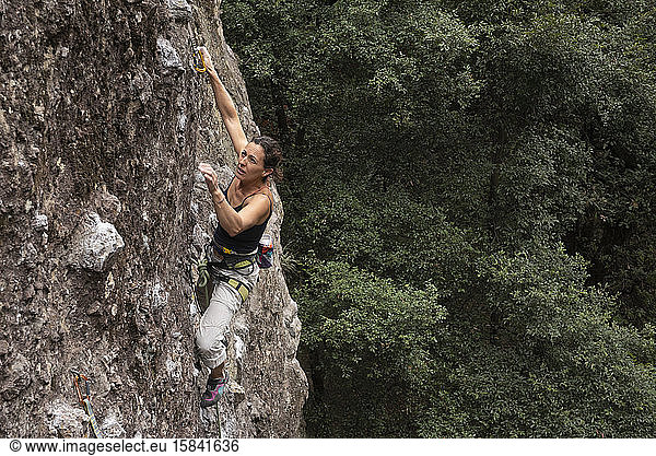Woman rock climbing in Jilotepec  Mexico.