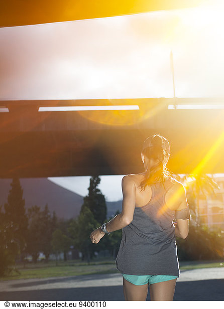 Woman running through city streets