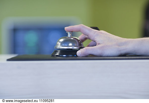 Woman's hand ringing bell for service  Freiburg Im Breisgau  Baden-Württemberg  Germany