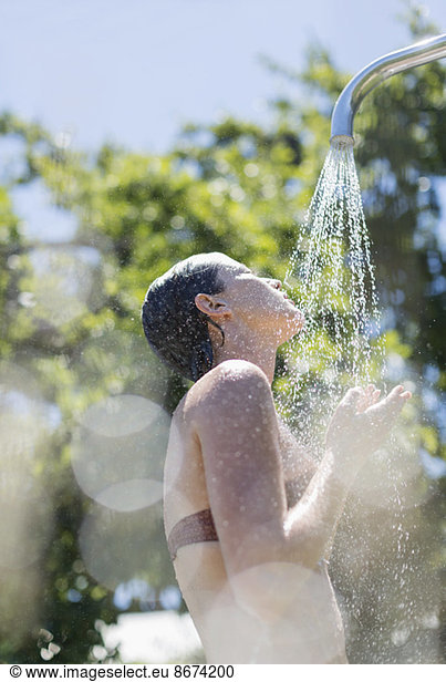 Woman showering outdoors