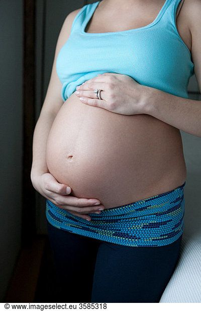 Woman showing pregnancy bump