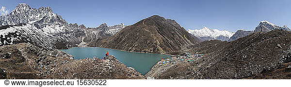 Woman sitting on rock at Gokyo Lake  Solo Khumbu  Nepal