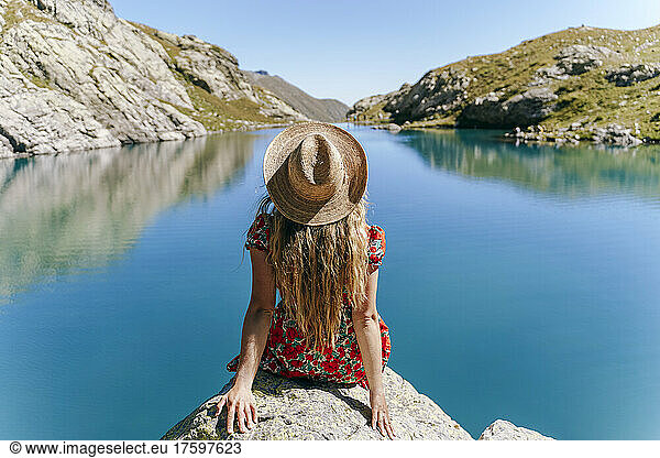 Woman sitting on rock looking at view  Sochi  Russia