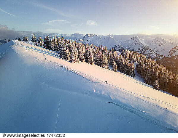 Woman skiing on snow covered mountain at sunrise  Schonkahler  Tyrol  Austria