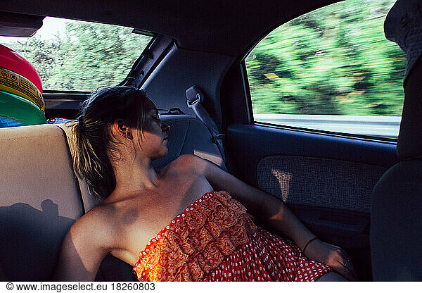 Woman sleeps in the car