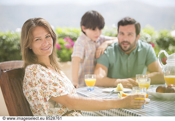 Woman smiling at patio table