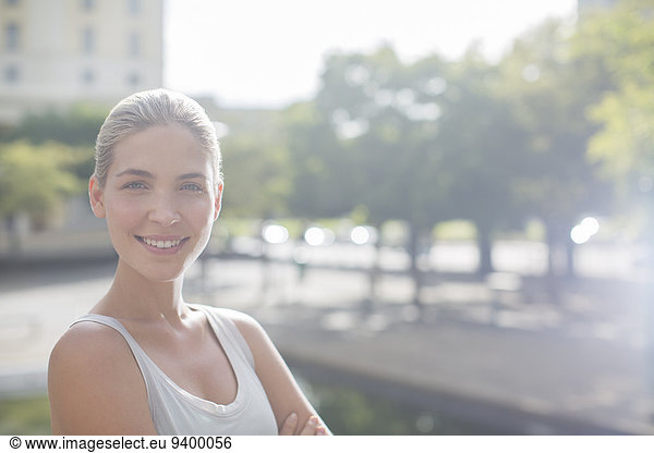 Woman smiling on city streets